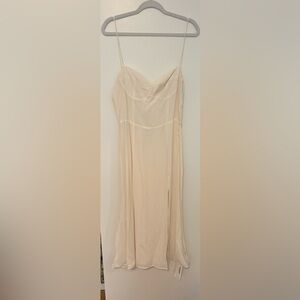 Reformation ivory dress with cup detail and high slit